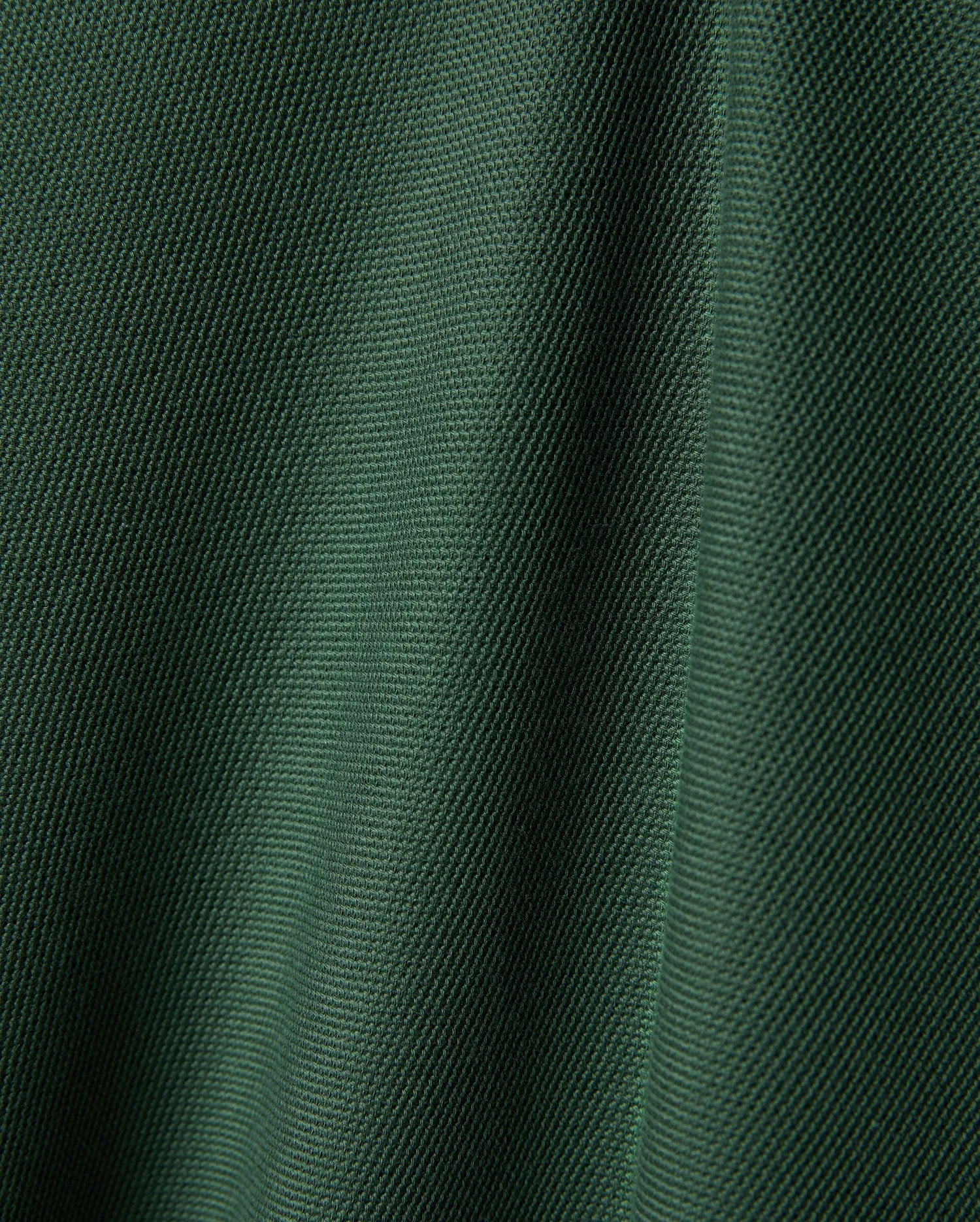 Psycho Bunny Mens Ringston Pique Polo, a premium refined streetwear piece in a rich, deep forest green, highlighting its classic, breathable pique knit texture.