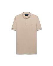 Mens Ringston Pique Polo in beige, featuring a classic fit, textured pique fabric, white tipping on the ribbed collar and cuffs, and a small embroidered Psycho Bunny skull logo on the left chest.