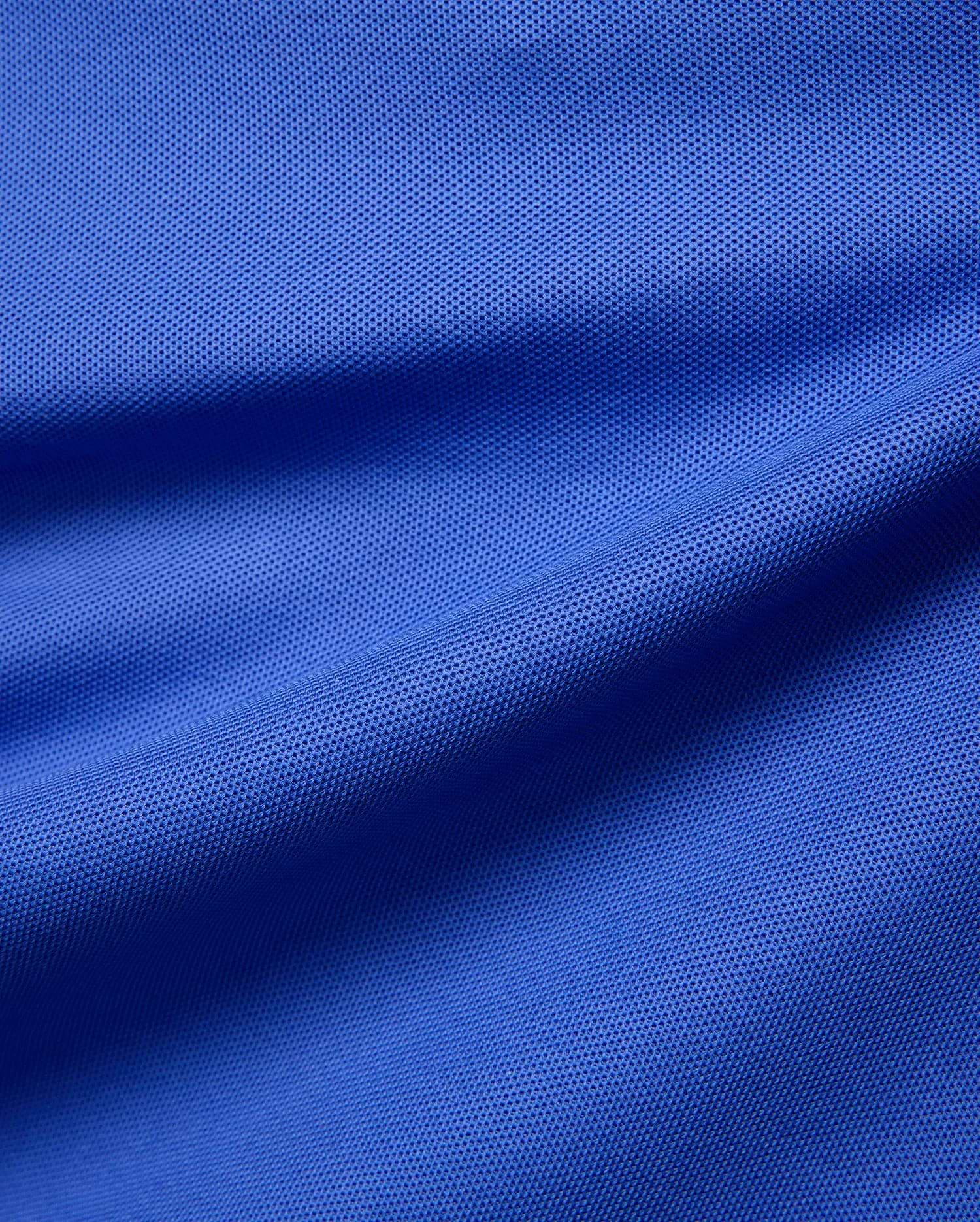 Mens Atley Pique Polo in vibrant royal blue, crafted from signature textured pique fabric, offering a classic fit. This premium Psycho Bunny polo features an embroidered bunny skull logo on the chest. (6)