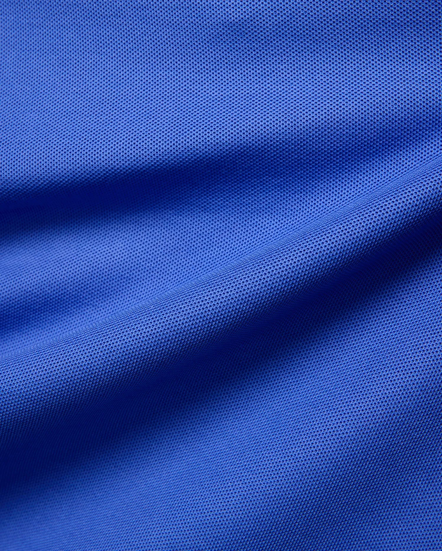 Mens Atley Pique Polo in vibrant royal blue, crafted from signature textured pique fabric, offering a classic fit. This premium Psycho Bunny polo features an embroidered bunny skull logo on the chest. (6)