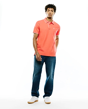 Mens Atley Pique Polo in vibrant coral pique fabric, featuring a classic fit, white tipping on the collar and sleeve cuffs, and a small embroidered white Psycho Bunny skull logo on the left chest. (4)