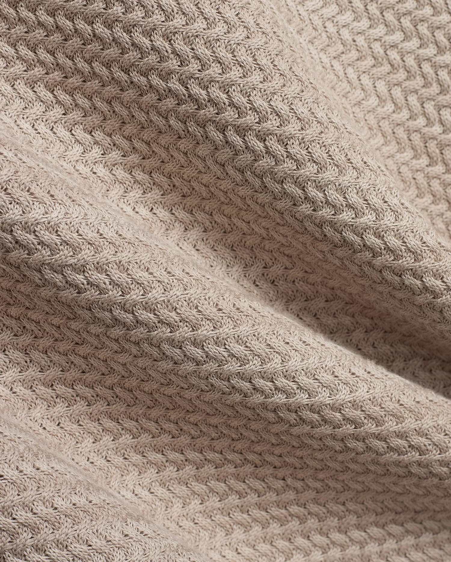 Mens Devon Braided Stitch Knit Polo, a premium beige knit polo featuring a refined, intricate braided stitch pattern, showcasing luxurious texture and sophisticated style.