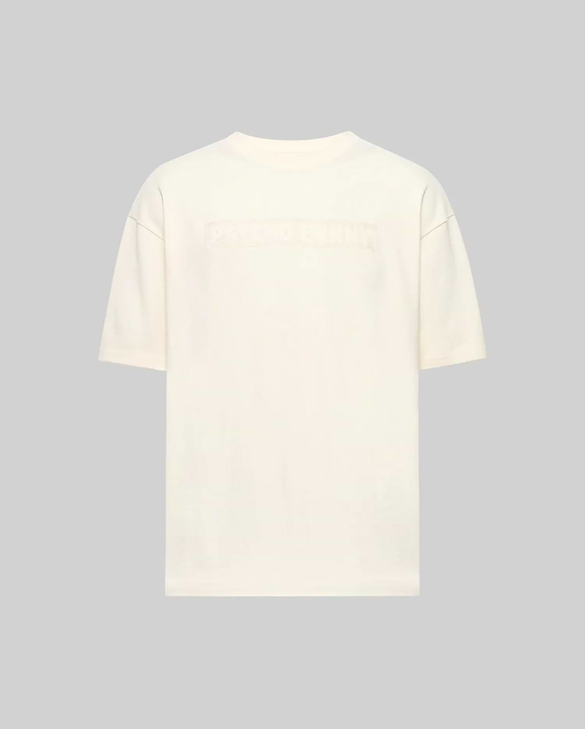 Back view of the Psycho Bunny MENS ZAYN OVERSIZED GRAPHIC TEE (MT0200004) in off-white, relaxed fit and heavyweight jersey, featuring subtle embossed text across the upper back against a light gray background.
