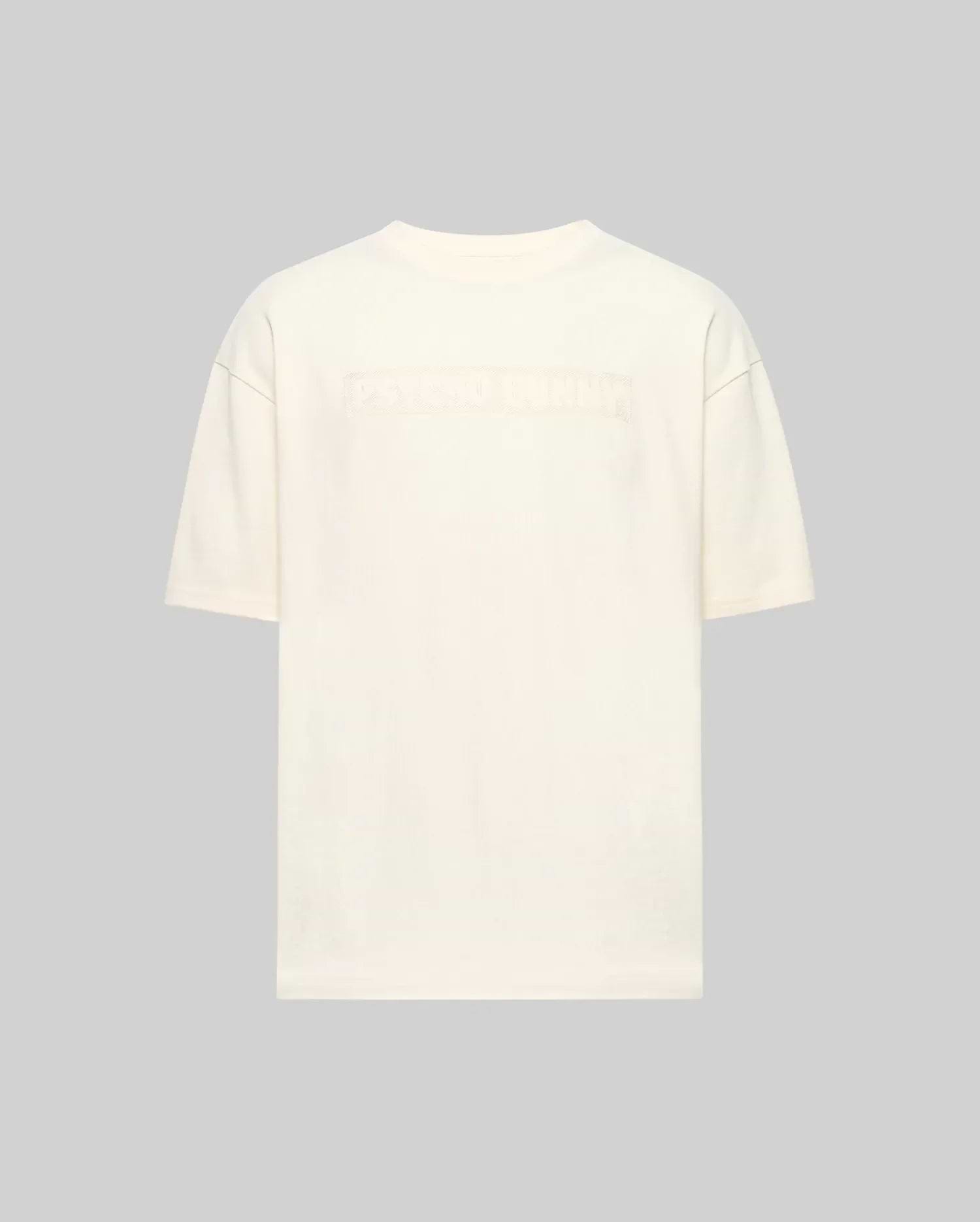Back view of the Psycho Bunny MENS ZAYN OVERSIZED GRAPHIC TEE (MT0200004) in off-white, relaxed fit and heavyweight jersey, featuring subtle embossed text across the upper back against a light gray background.