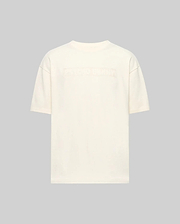 Back view of the Psycho Bunny MENS ZAYN OVERSIZED GRAPHIC TEE (MT0200004) in off-white, relaxed fit and heavyweight jersey, featuring subtle embossed text across the upper back against a light gray background.