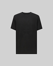 The Psycho Bunny MENS REMY GRAPHIC TEE - MT0200059 is crafted from soft Pima cotton and features a subtle embossed bunny logo above crossed bones on the front, shown against a plain light gray background.