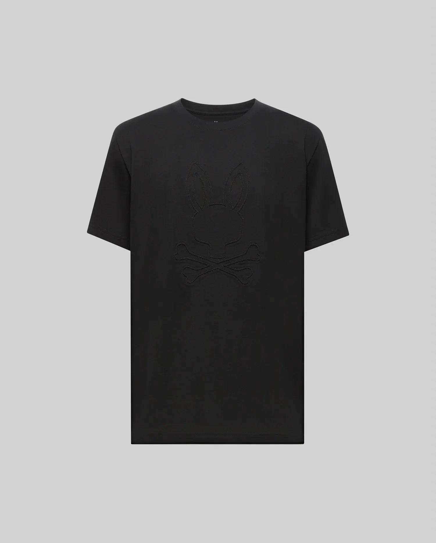 The Psycho Bunny MENS REMY GRAPHIC TEE - MT0200059 is crafted from soft Pima cotton and features a subtle embossed bunny logo above crossed bones on the front, shown against a plain light gray background.