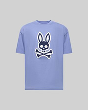The Psycho Bunny MENS RYDER OVERSIZED FIT TEE (MT0200062) is a light purple premium tee with a bold black and white bunny skull and crossbones graphic on the front, shown against a plain gray background. (1)