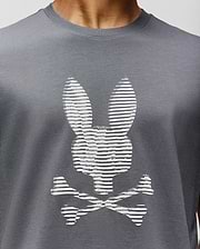A close-up of the Psycho Bunny MENS GRANT BUNNY GRAPHIC TEE (MT0200081), crafted in Peru from soft Pima cotton, featuring a white bunny head with long ears above crossed bones for a playful twist on the classic graphic. (3)