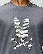 A close-up of the Psycho Bunny MENS GRANT BUNNY GRAPHIC TEE (MT0200081), crafted in Peru from soft Pima cotton, featuring a white bunny head with long ears above crossed bones for a playful twist on the classic graphic. (3)