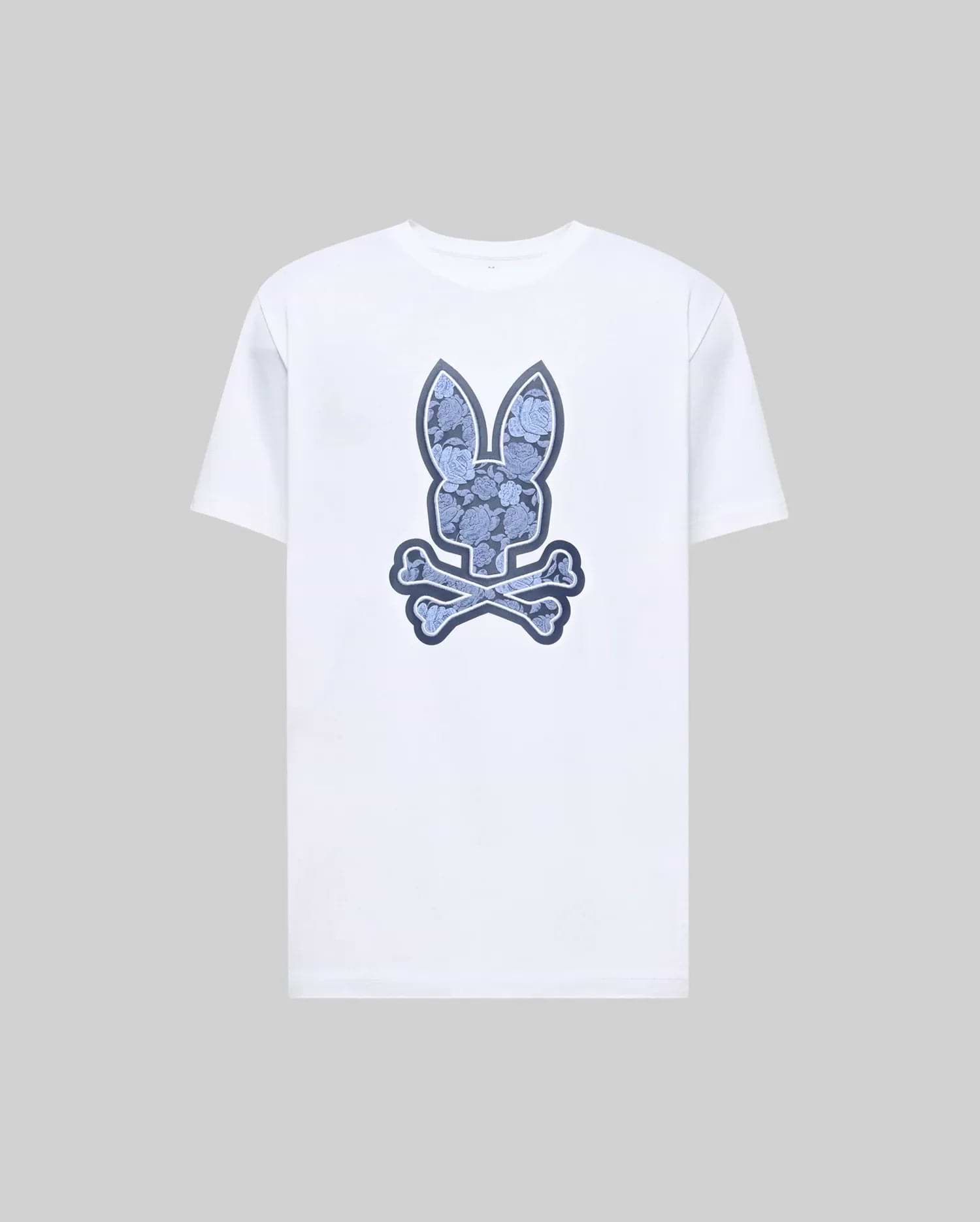 The Psycho Bunny MENS ROWEN BUNNY GRAPHIC TEE (MT0200101) is a white short-sleeve shirt with a large blue bunny head above crossed bones graphic on the front, shown on a plain gray background. (1)