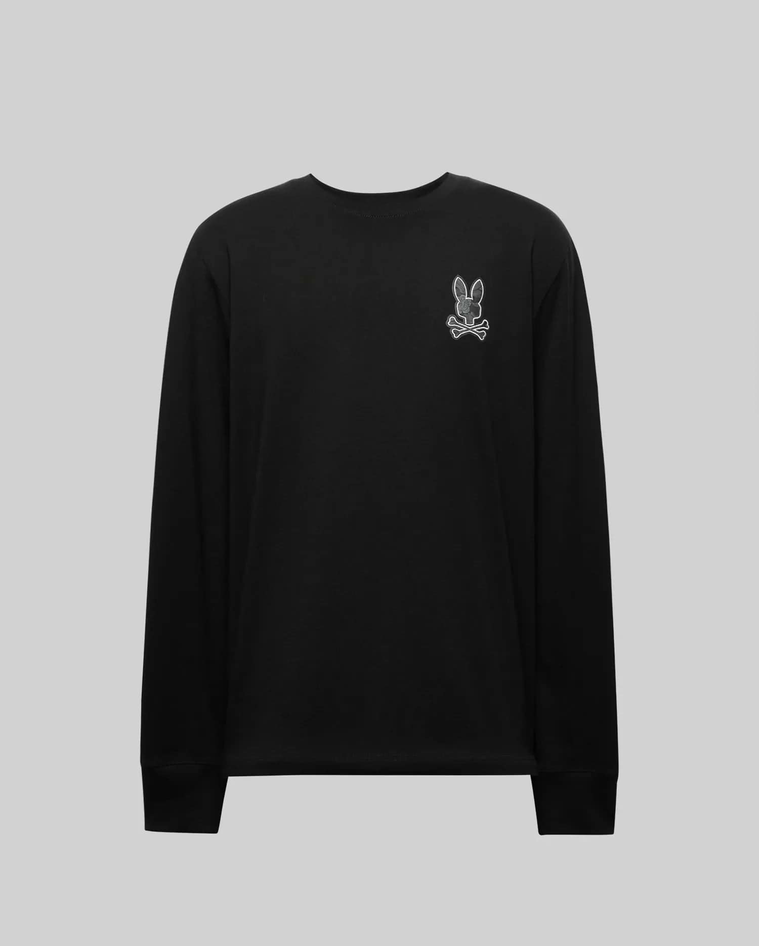 The MENS ROWEN GRAPHIC TEE - MT0200103 by Psycho Bunny is a black long sleeve crewneck featuring a small white outlined cartoon bunny patch on the left chest, shown against a plain light gray background. (6)