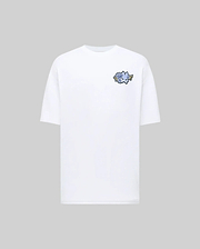 The Psycho Bunny MENS AUGUSTE OVERSIZED TEE - MT0200104 is a relaxed-fit white tee with a small blue rose and green stem graphic on the left chest, shown against a light grey background for effortless style.
