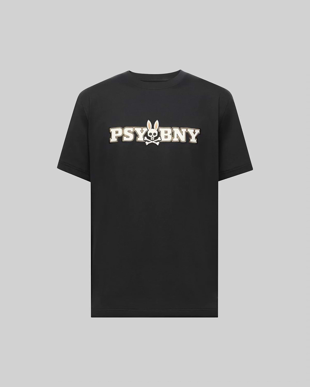 The MENS WADE GRAPHIC TEE - MT0200105 by Psycho Bunny is a black, 100% cotton short-sleeve shirt featuring bold white "PSYBNY" text and a bunny face with crossbones graphic, shown on a plain gray background. (1)