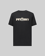 The MENS WADE GRAPHIC TEE - MT0200105 by Psycho Bunny is a black, 100% cotton short-sleeve shirt featuring bold white "PSYBNY" text and a bunny face with crossbones graphic, shown on a plain gray background. (1)