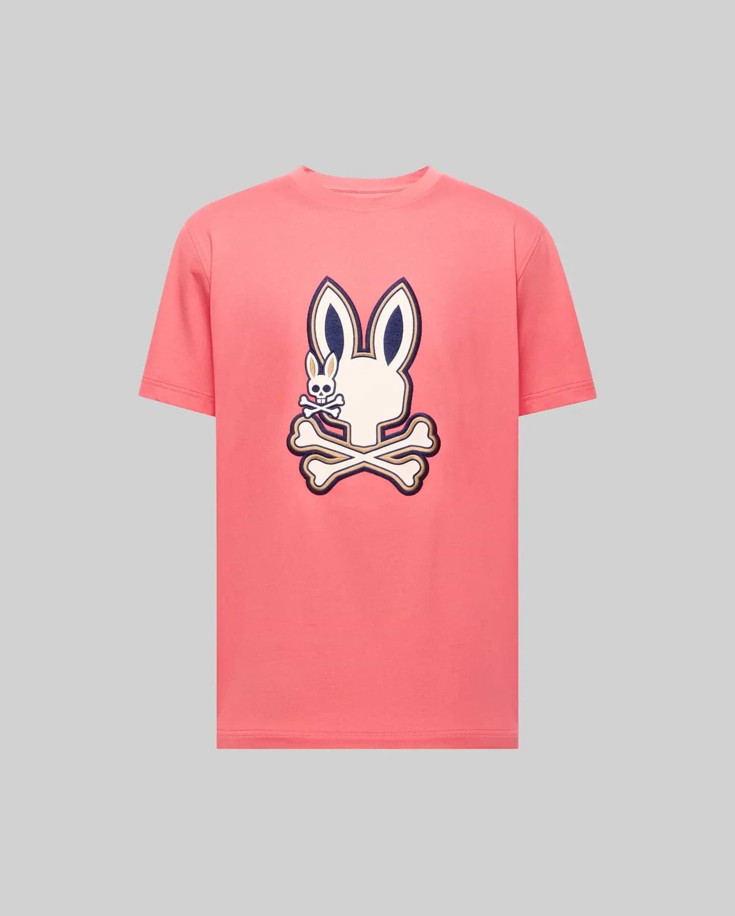 The Psycho Bunny MENS WADE GRAPHIC TEE - MT0200106 is a light gray, 100% cotton, short-sleeve shirt with a large embroidered pink bunny head and crossbones, outlined in dark blue and centered on the chest. (1)