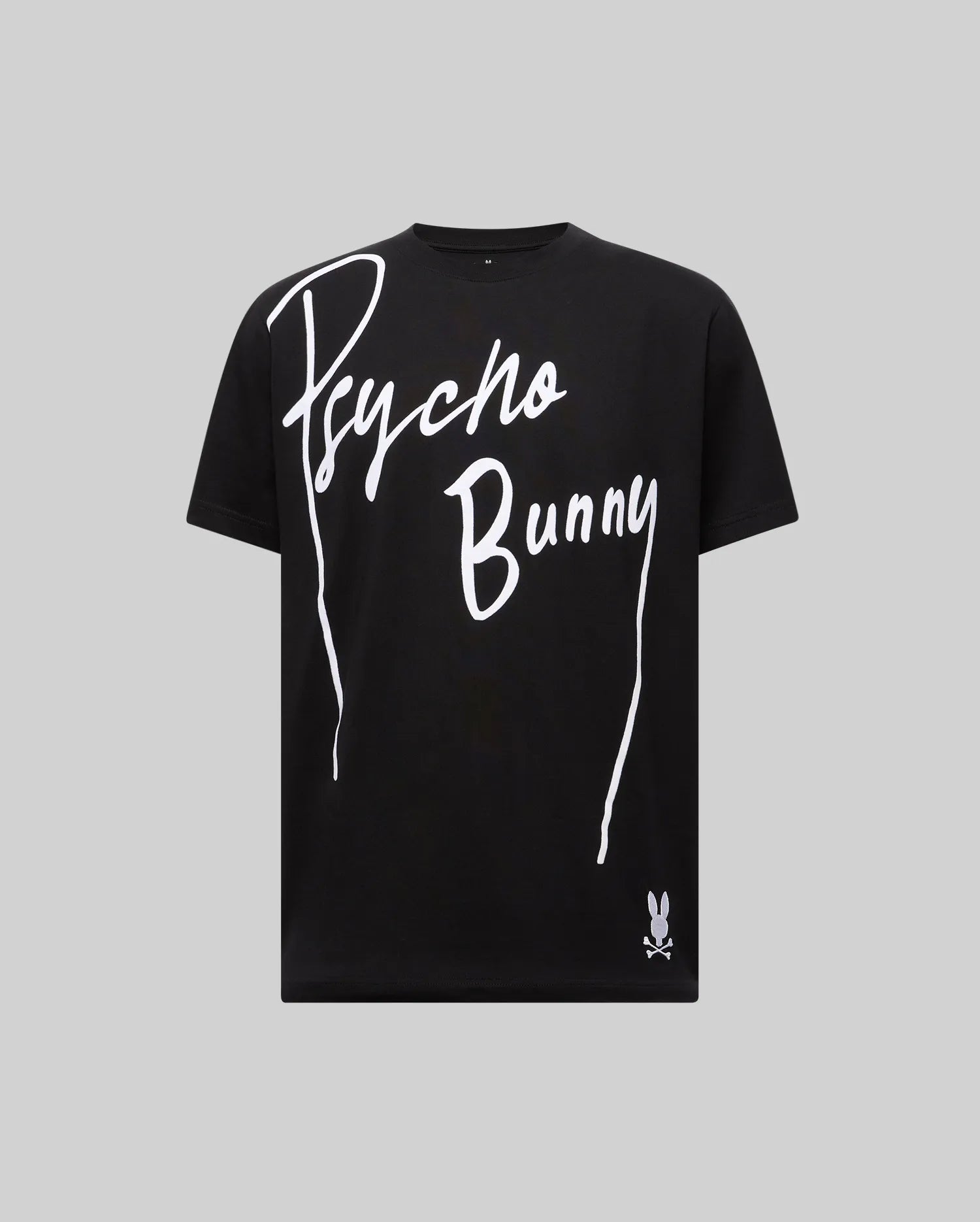 The MENS SOREN GRAPHIC TEE - MT0200180 by Psycho Bunny is a black 100% cotton tee featuring a bold white "Psycho Bunny" wordmark and bunny skull logo near the hem, shown on a plain gray background. (1)