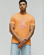 Vibrant Orange Mens Olivier Graphic Tee, classic fit, smooth jersey knit, featuring a large, textured pink, yellow, and white Psycho Bunny skull and crossbones graphic on the chest. (4)