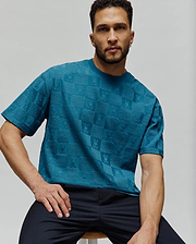 Mens Dustin Oversized Tee in deep teal, featuring a relaxed fit and an all-over tonal embossed checkerboard pattern with Psycho Bunny skull logos. (2)