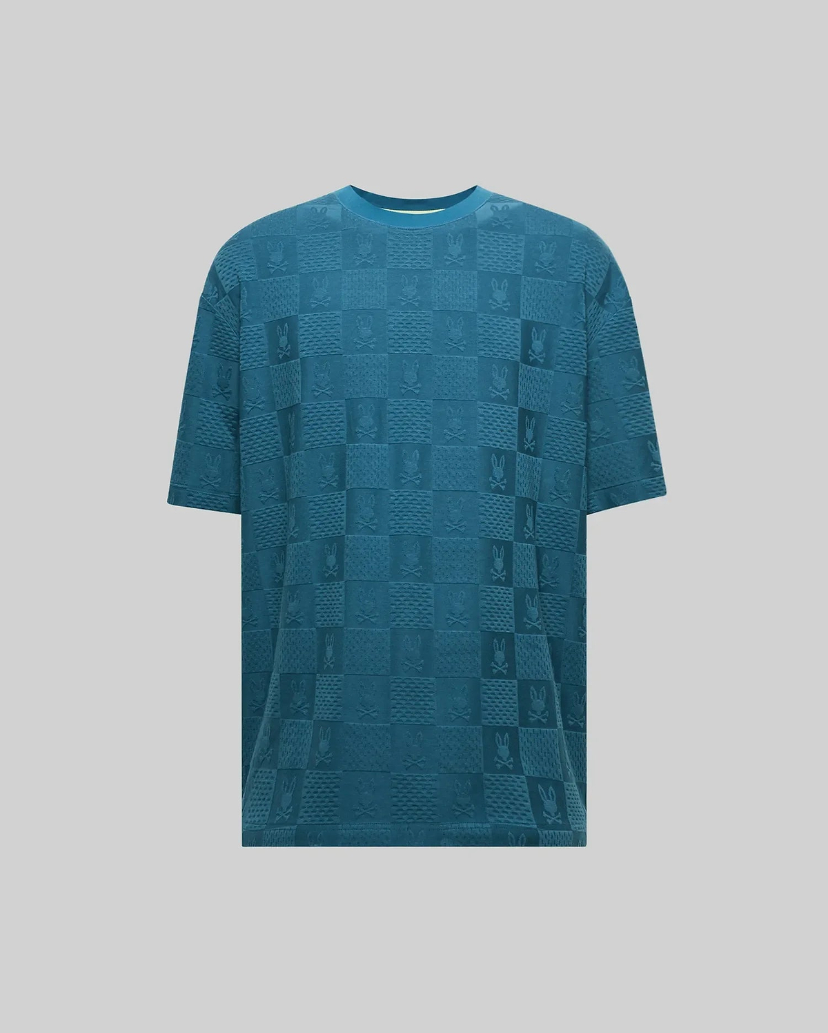 Mens Dustin Oversized Tee in teal, featuring an all-over tonal jacquard checkerboard pattern with alternating Psycho Bunny skull logos and textured squares, offering a relaxed fit. (5)
