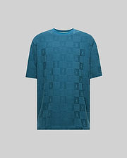 Mens Dustin Oversized Tee in teal, featuring an all-over tonal jacquard checkerboard pattern with alternating Psycho Bunny skull logos and textured squares, offering a relaxed fit. (5)