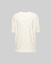Creamy white relaxed fit t-shirt with an all-over subtle checkerboard pattern featuring embossed Psycho Bunny skull logos and textured squares in a jacquard knit. (4)