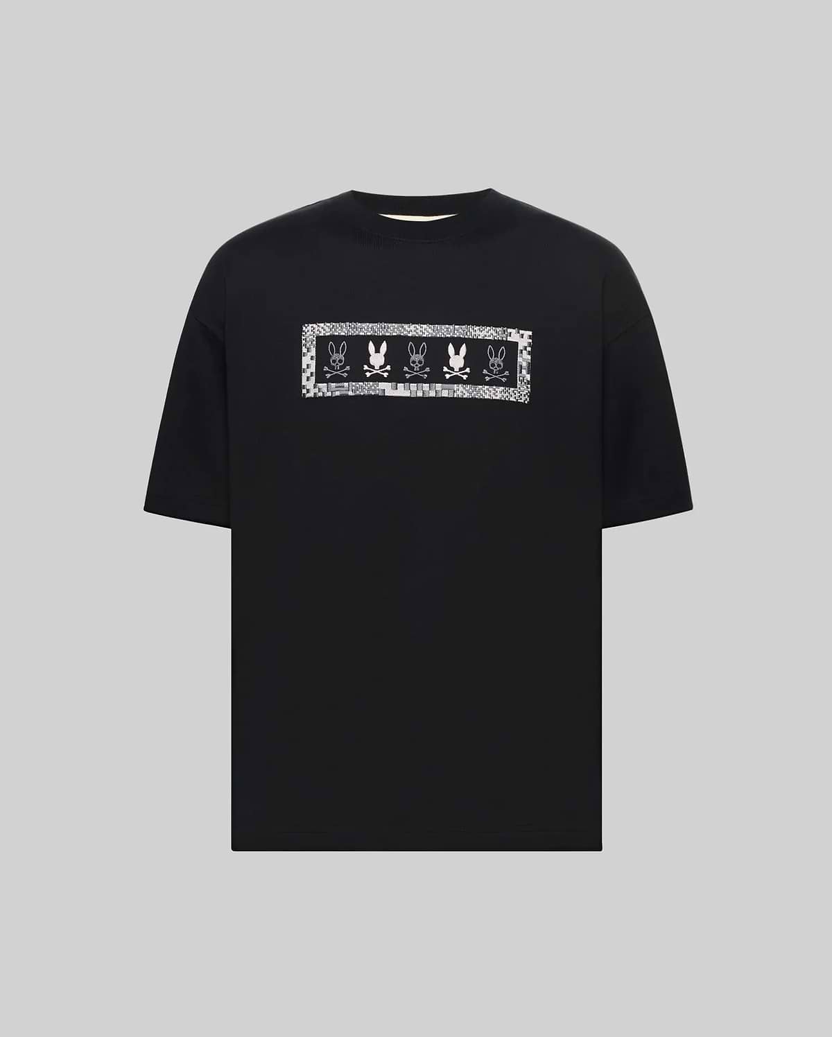 Mens Olivier Oversized Tee, a black jersey t-shirt with an oversized fit, featuring a large white and silver pixelated chest graphic of repeating Psycho Bunny skull logos. (4)
