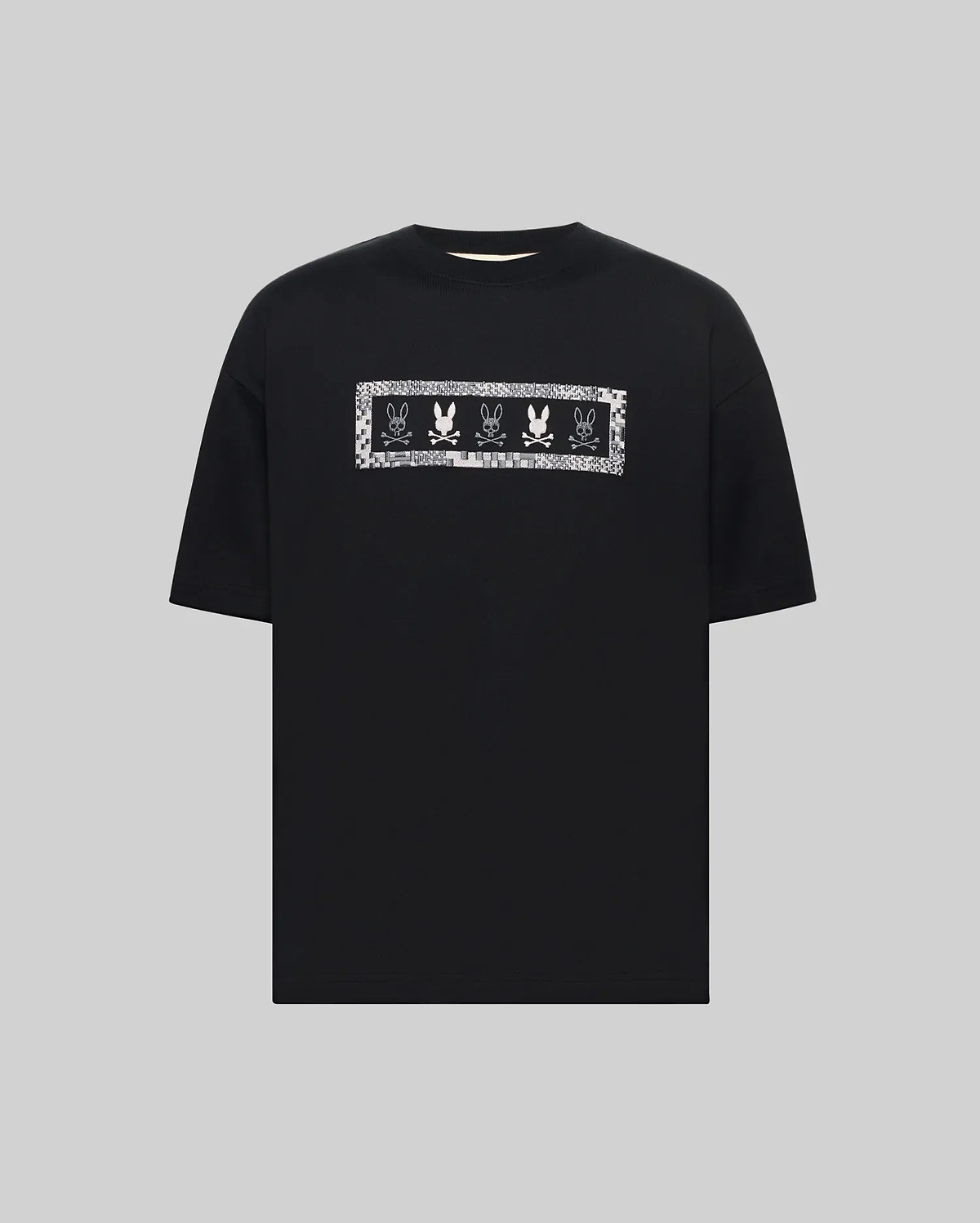 Mens Olivier Oversized Tee, a black jersey t-shirt with an oversized fit, featuring a large white and silver pixelated chest graphic of repeating Psycho Bunny skull logos. (4)
