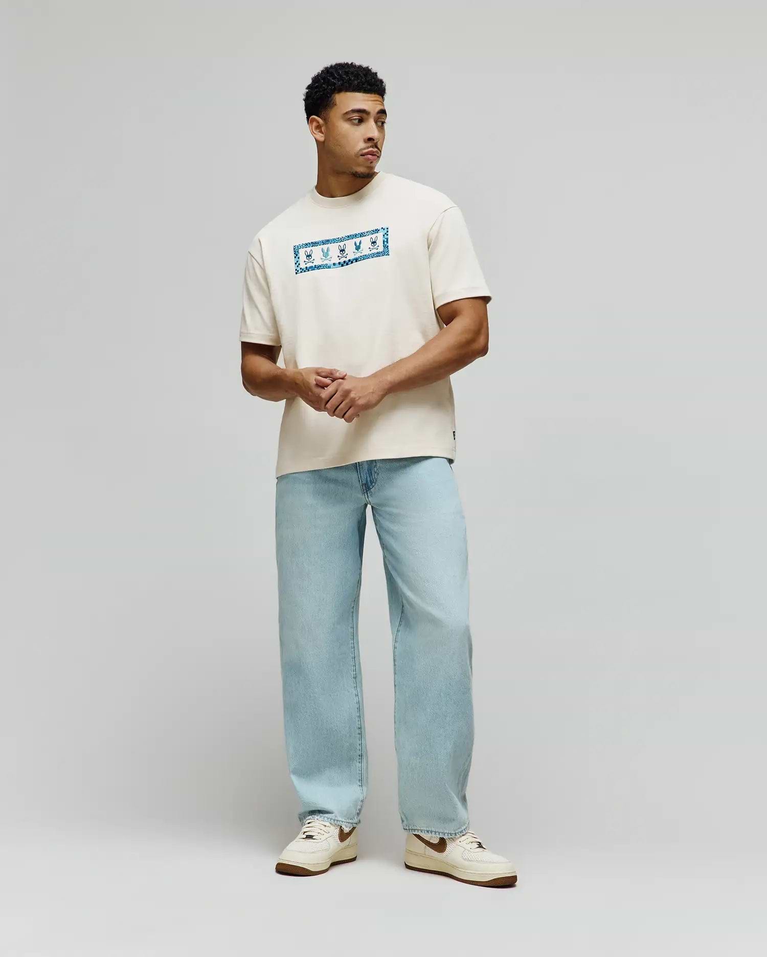 Mens Olivier Oversized Tee in cream jersey knit, featuring a prominent central chest graphic with a vibrant blue bandana-style pattern and white Psycho Bunny skull logos. (3)