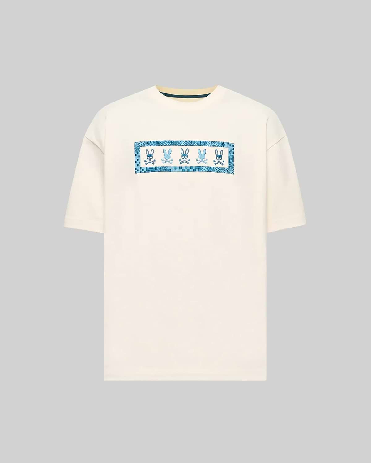 Mens Olivier Oversized Tee in cream, featuring a central chest graphic with multiple blue Psycho Bunny skull logos framed by a pixelated blue border. Smooth jersey knit, oversized fit. (4)