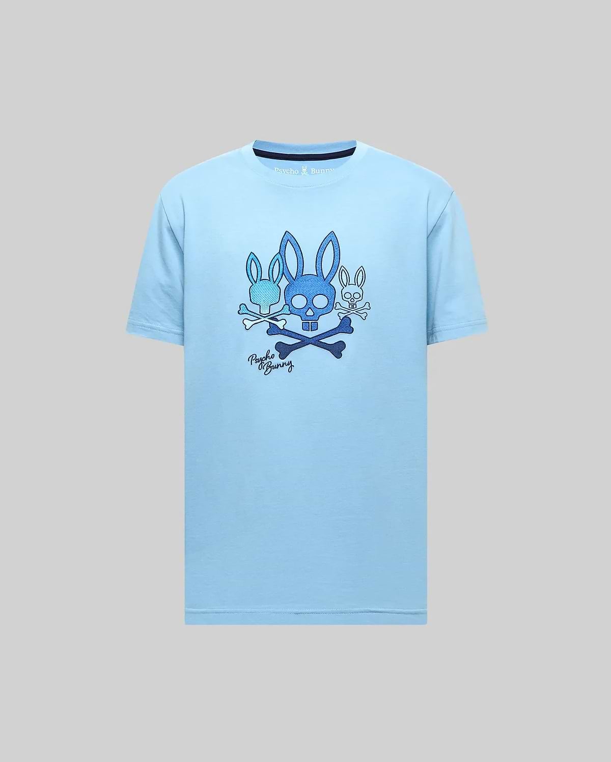 Mens Oscar Graphic Tee, light blue classic fit jersey t-shirt featuring a large chest graphic of three blue Psycho Bunny skull and crossbones logos, script, and dark blue collar trim. (2)