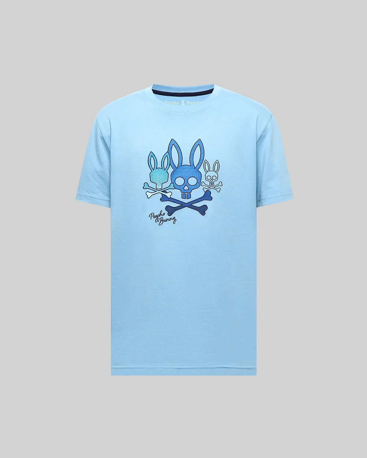 Mens Oscar Graphic Tee, light blue classic fit jersey t-shirt featuring a large chest graphic of three blue Psycho Bunny skull and crossbones logos, script, and dark blue collar trim. (2)