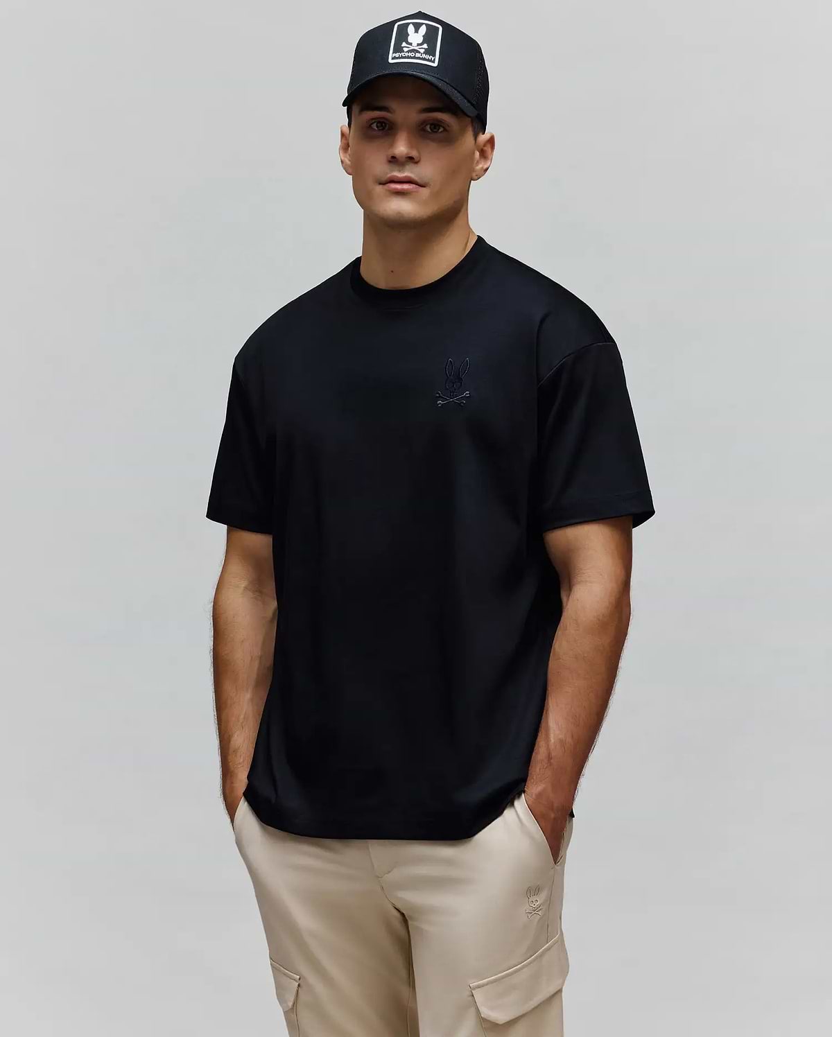Mens Oscar Oversized Tee, a black oversized jersey t-shirt featuring a tonal embroidered Psycho Bunny skull logo on the left chest.