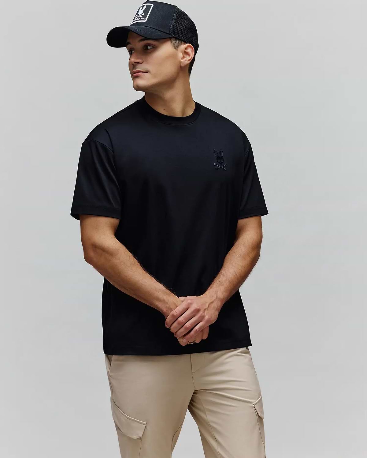 Black Mens Oscar Oversized Tee, crafted from smooth jersey fabric, featuring a relaxed fit and a small, tonal embroidered Psycho Bunny skull and crossbones logo on the left chest.