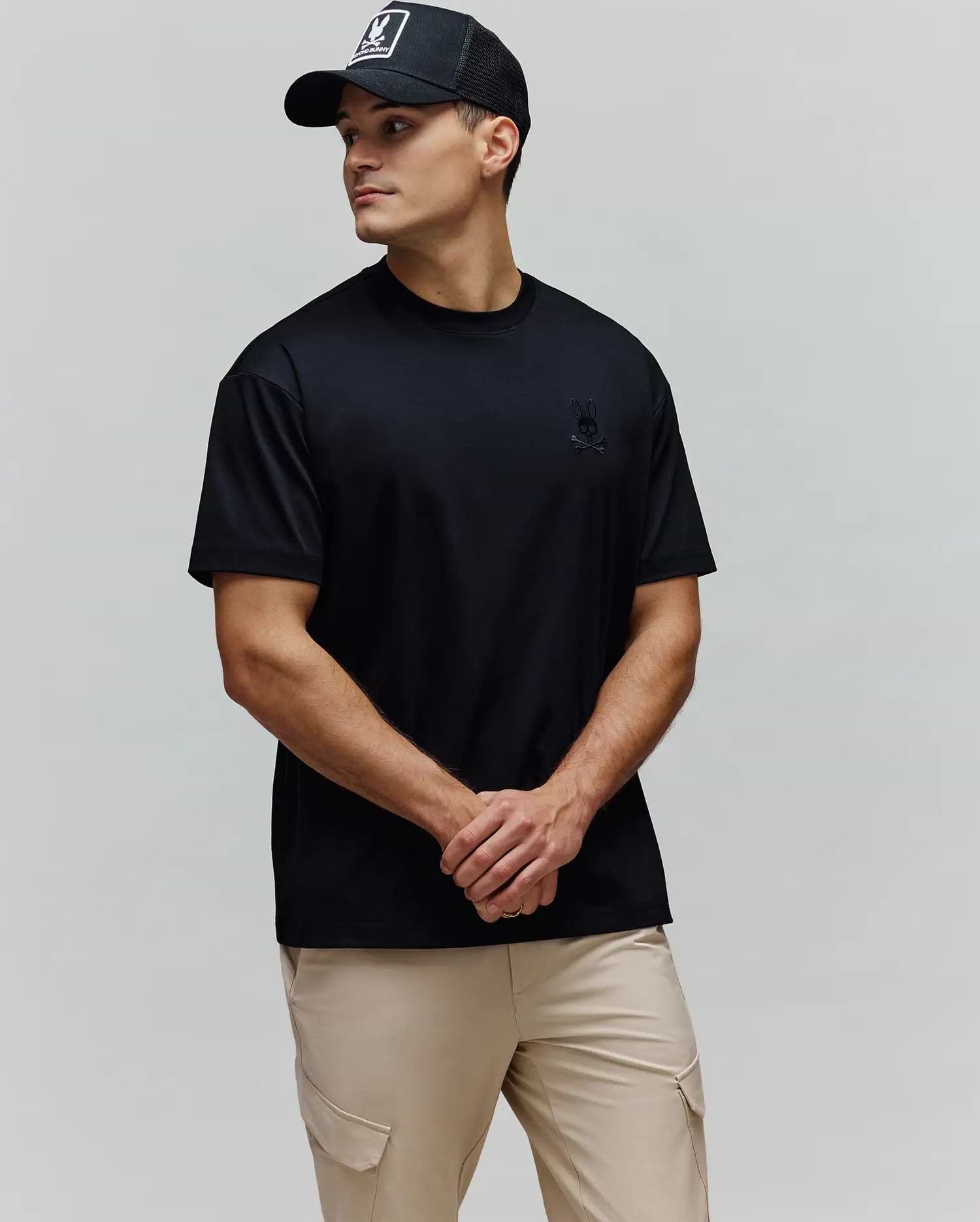 Black Mens Oscar Oversized Tee, crafted from smooth jersey fabric, featuring a relaxed fit and a small, tonal embroidered Psycho Bunny skull and crossbones logo on the left chest.