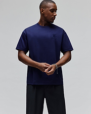 Mens Oscar Oversized Tee in deep navy blue, featuring a small, tonal embroidered Psycho Bunny skull logo on the left chest, crafted from smooth jersey fabric for a relaxed fit.