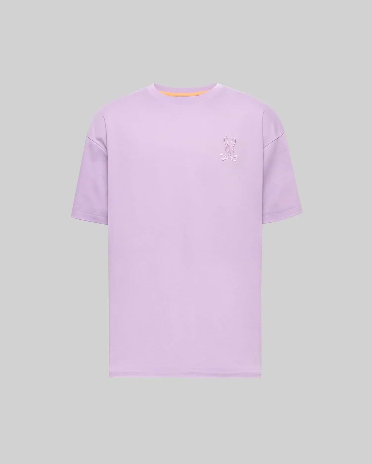 Mens Oscar Oversized Tee, a lavender oversized jersey t-shirt featuring a small embroidered Psycho Bunny skull logo on the left chest and a subtle orange neckline trim. (4)