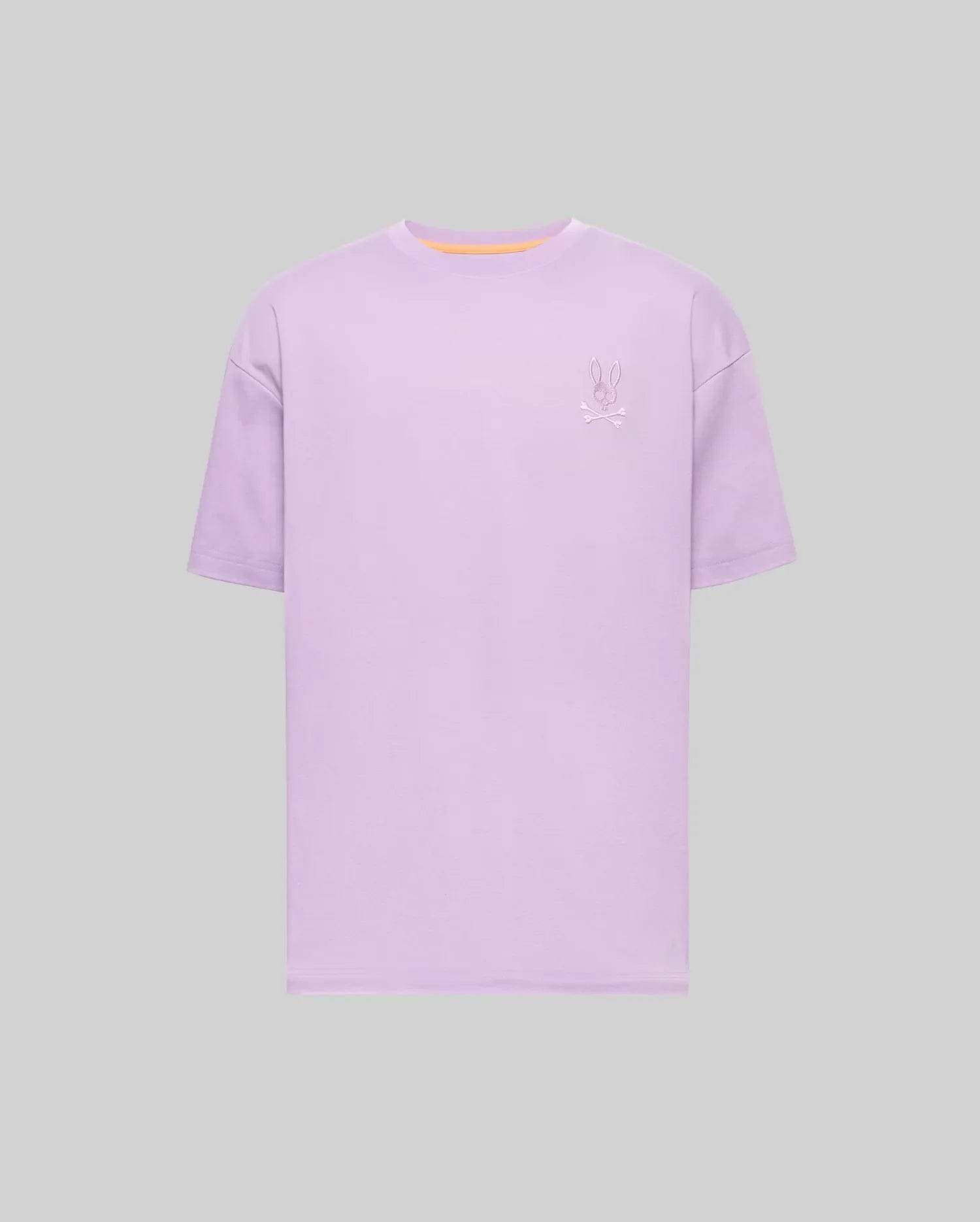 Mens Oscar Oversized Tee, a lavender oversized jersey t-shirt featuring a small embroidered Psycho Bunny skull logo on the left chest and a subtle orange neckline trim. (4)