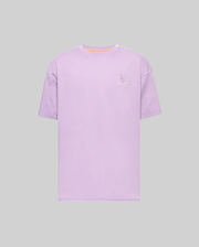 Mens Oscar Oversized Tee, a lavender oversized jersey t-shirt featuring a small embroidered Psycho Bunny skull logo on the left chest and a subtle orange neckline trim. (4)
