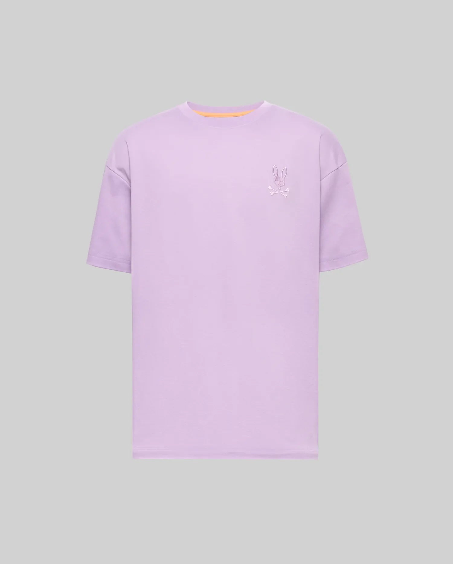 Mens Oscar Oversized Tee, a lavender oversized jersey t-shirt featuring a small embroidered Psycho Bunny skull logo on the left chest and a subtle orange neckline trim. (4)