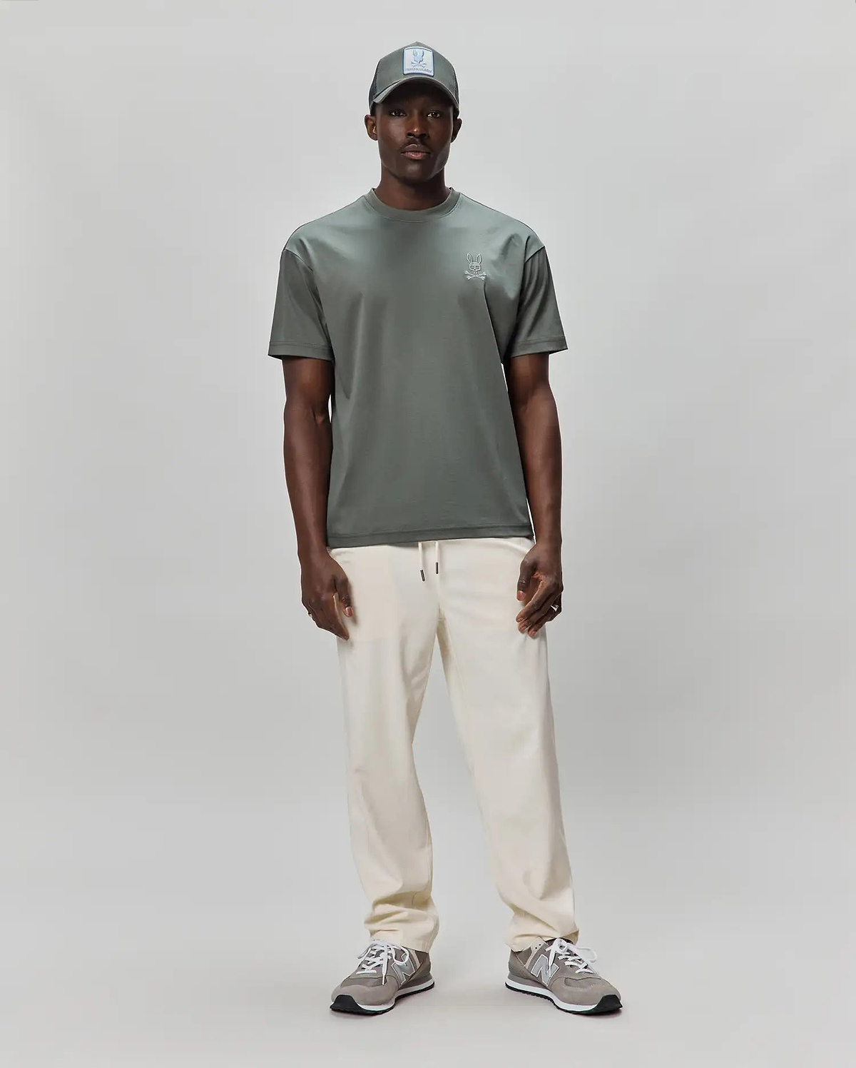 Mens Oscar Oversized Tee in muted sage green, crafted from soft jersey knit, featuring a small, embroidered white Psycho Bunny skull logo on the left chest for premium streetwear style.