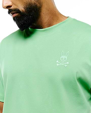 MENS OSCAR RELAXED FIT TEE in soft mint green jersey knit, featuring a small white embroidered Psycho Bunny skull and crossbones logo on the left chest.