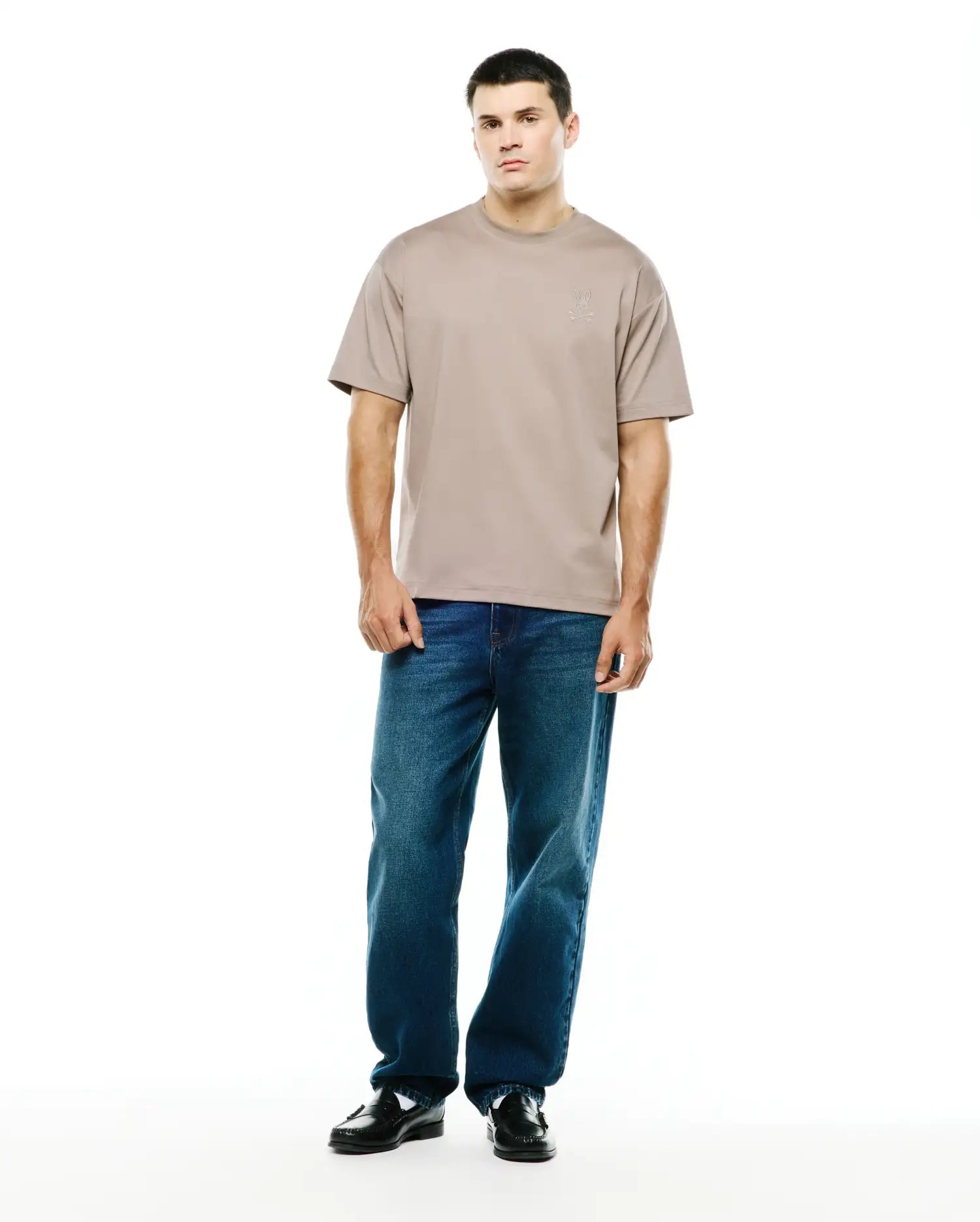 Men's Oscar Oversized Tee in taupe, crafted from smooth jersey fabric with an oversized fit, featuring a small, tonal embroidered Psycho Bunny skull logo on the left chest. (4)