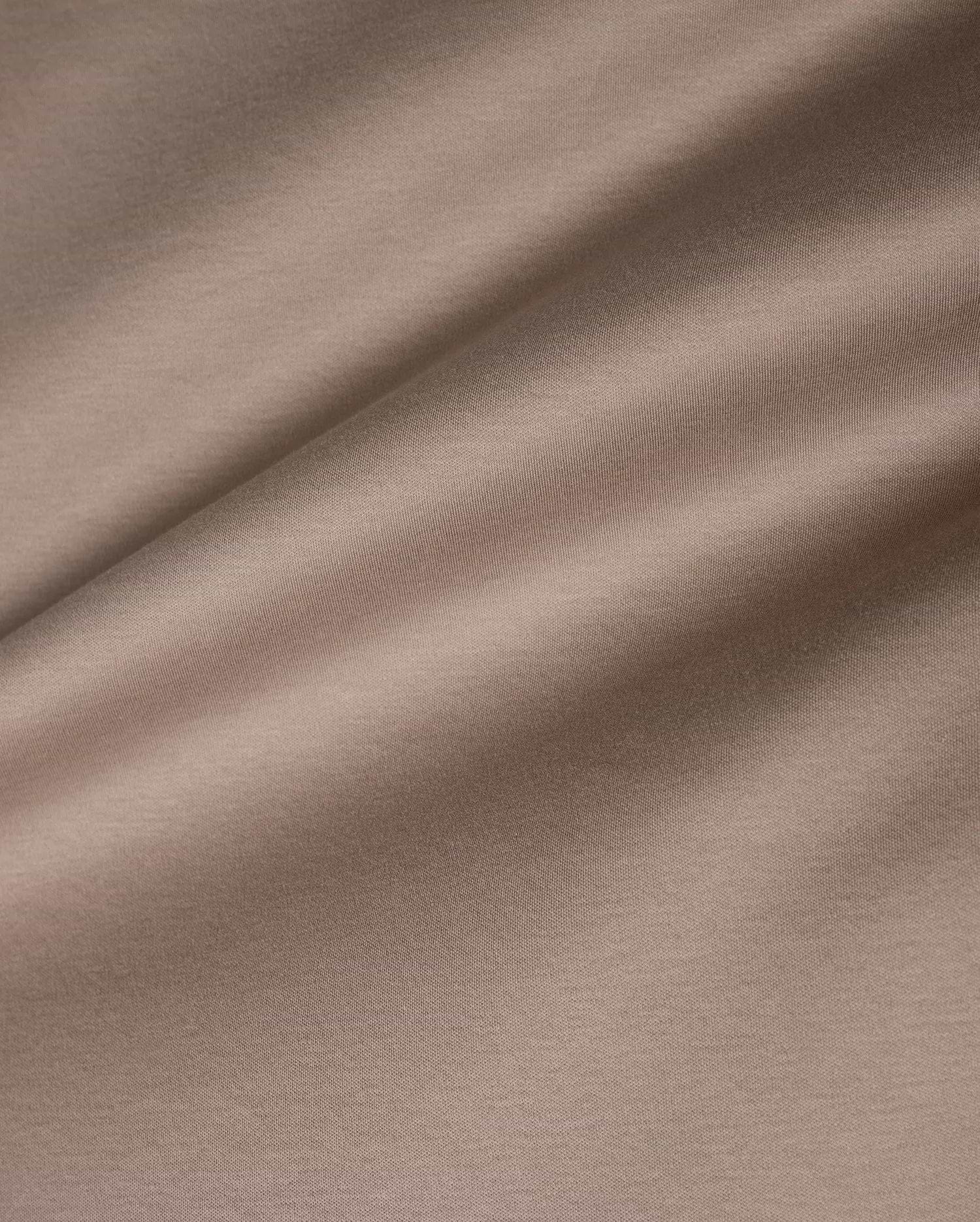 Men's Oscar Oversized Tee in premium, soft taupe jersey knit fabric, featuring a smooth texture with subtle horizontal ribbing and a relaxed drape, ideal for refined streetwear. (6)