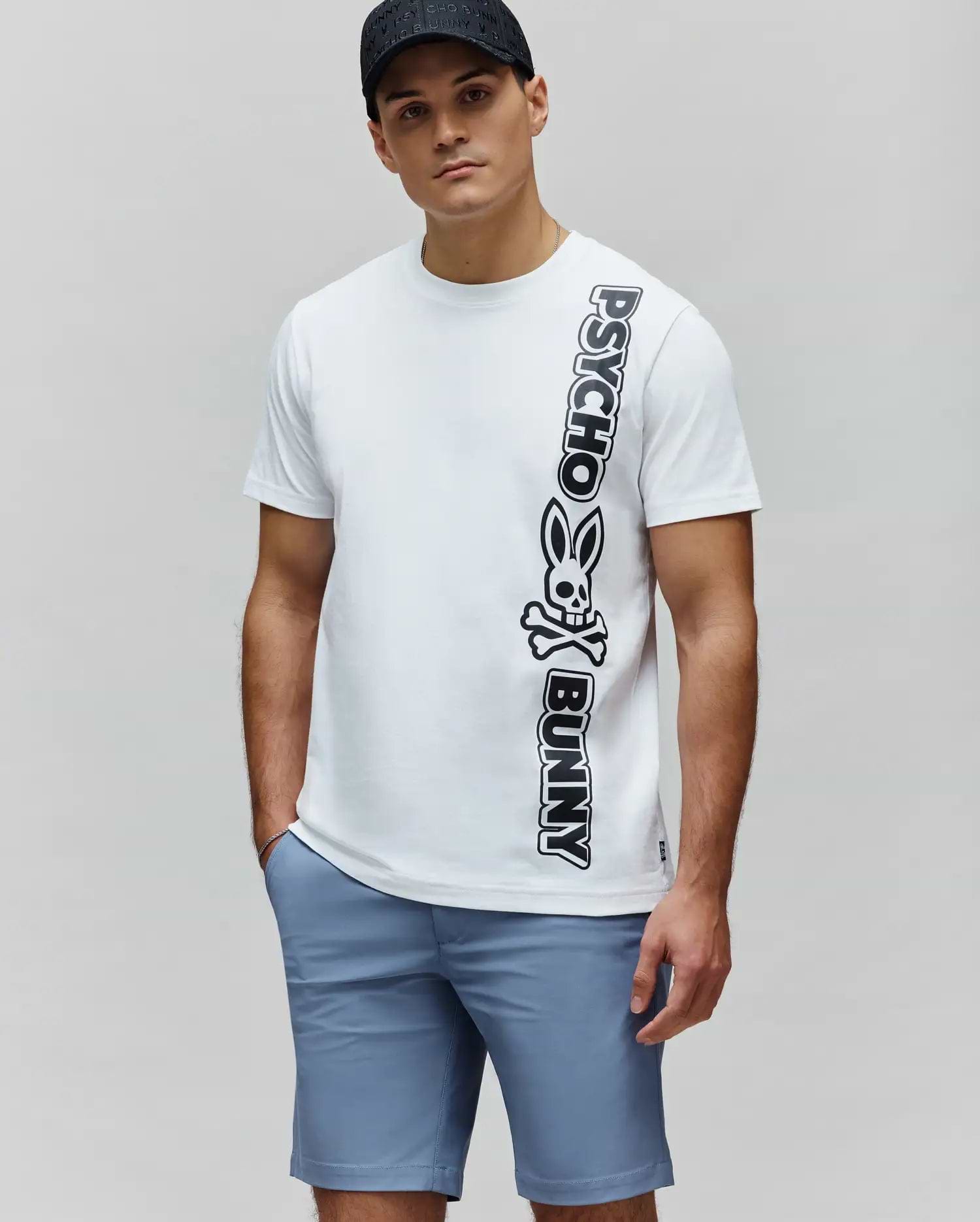 White Mens Toby Wordmark Tee, classic fit, smooth jersey knit, featuring a large vertical black Psycho Bunny wordmark and skull logo on the left side. (1)
