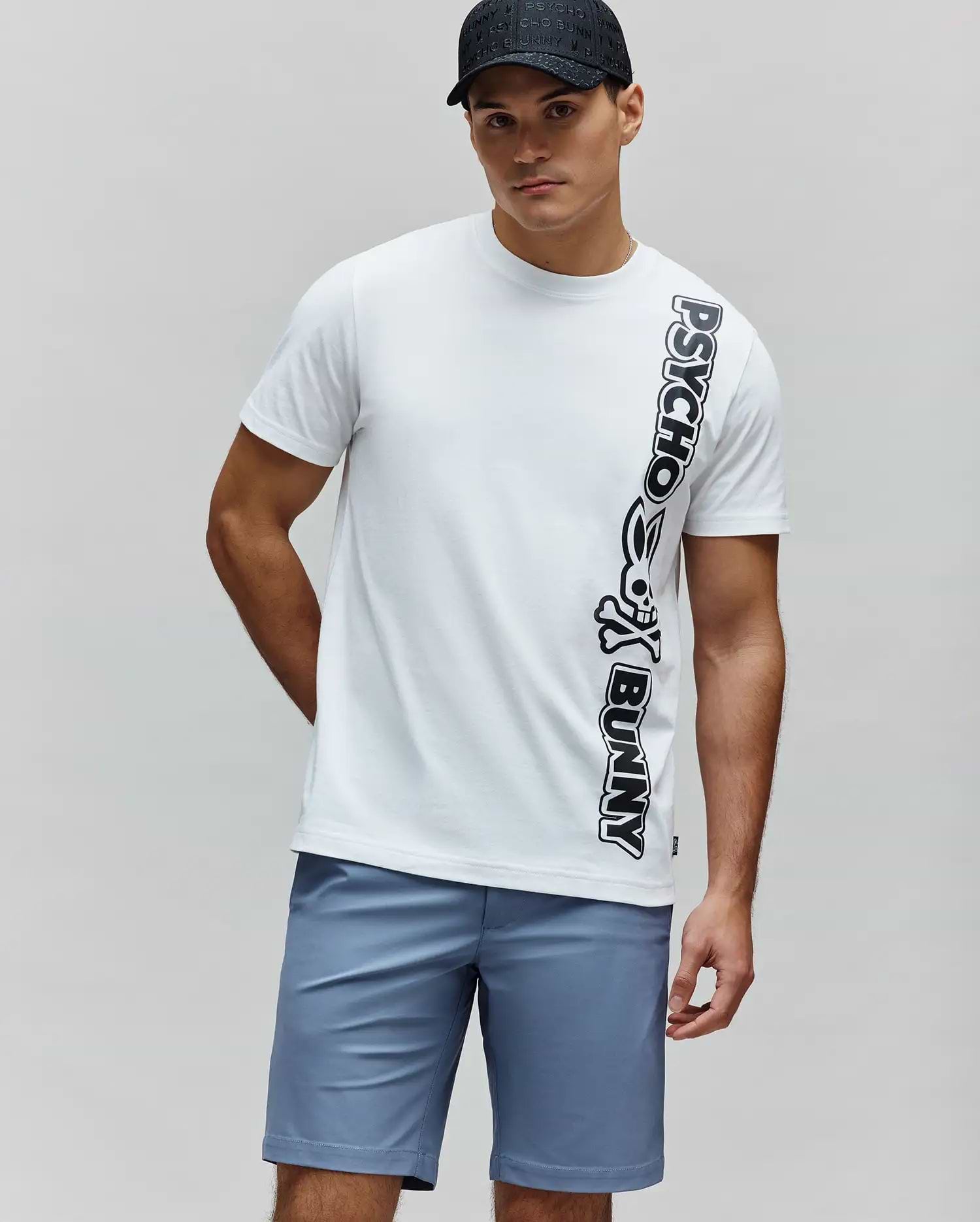 White Mens Toby Wordmark Tee in classic fit soft jersey, featuring a large vertical black Psycho Bunny wordmark with the iconic skull logo on the right side of the torso. (3)