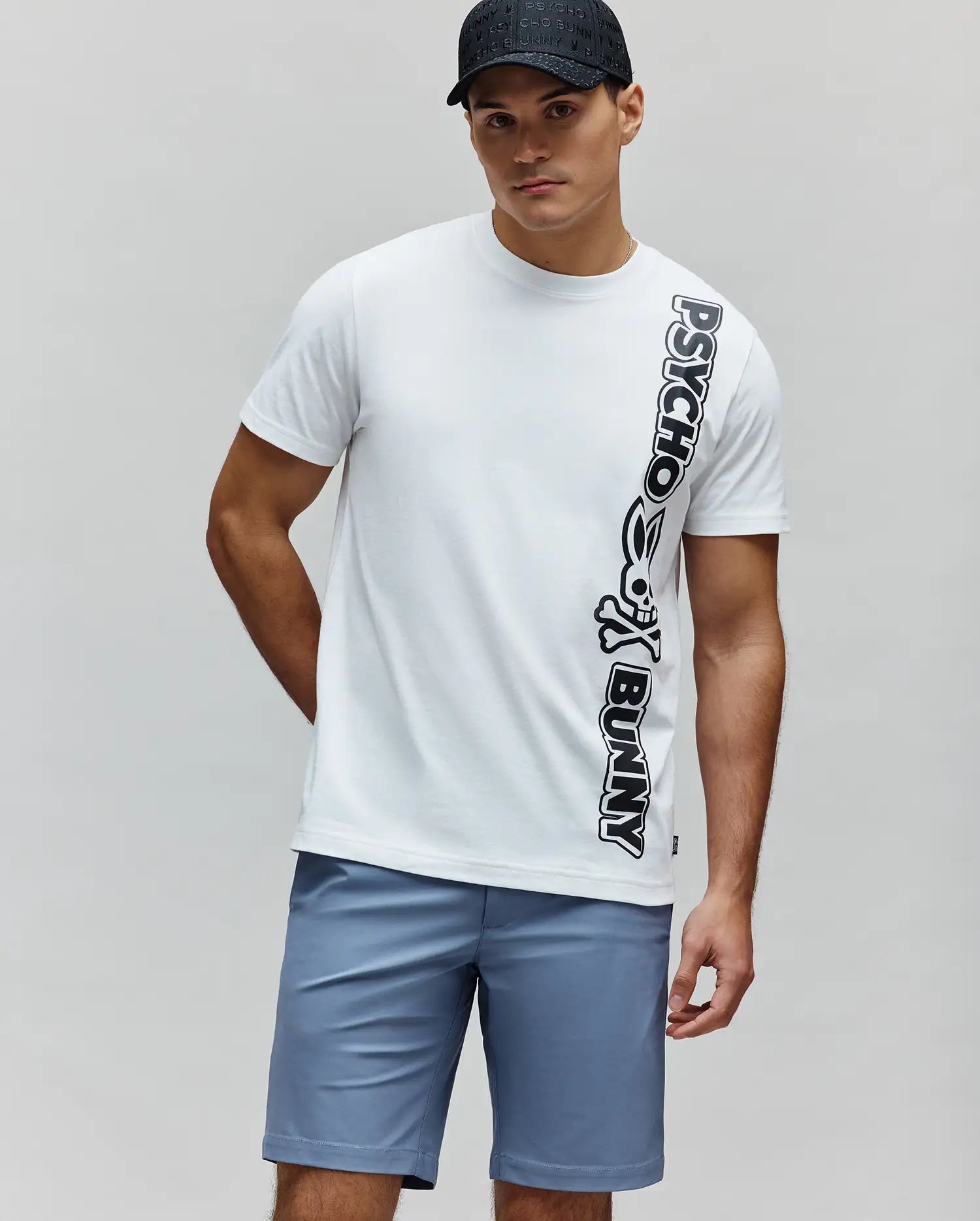 White Mens Toby Wordmark Tee in classic fit soft jersey, featuring a large vertical black Psycho Bunny wordmark with the iconic skull logo on the right side of the torso. (3)