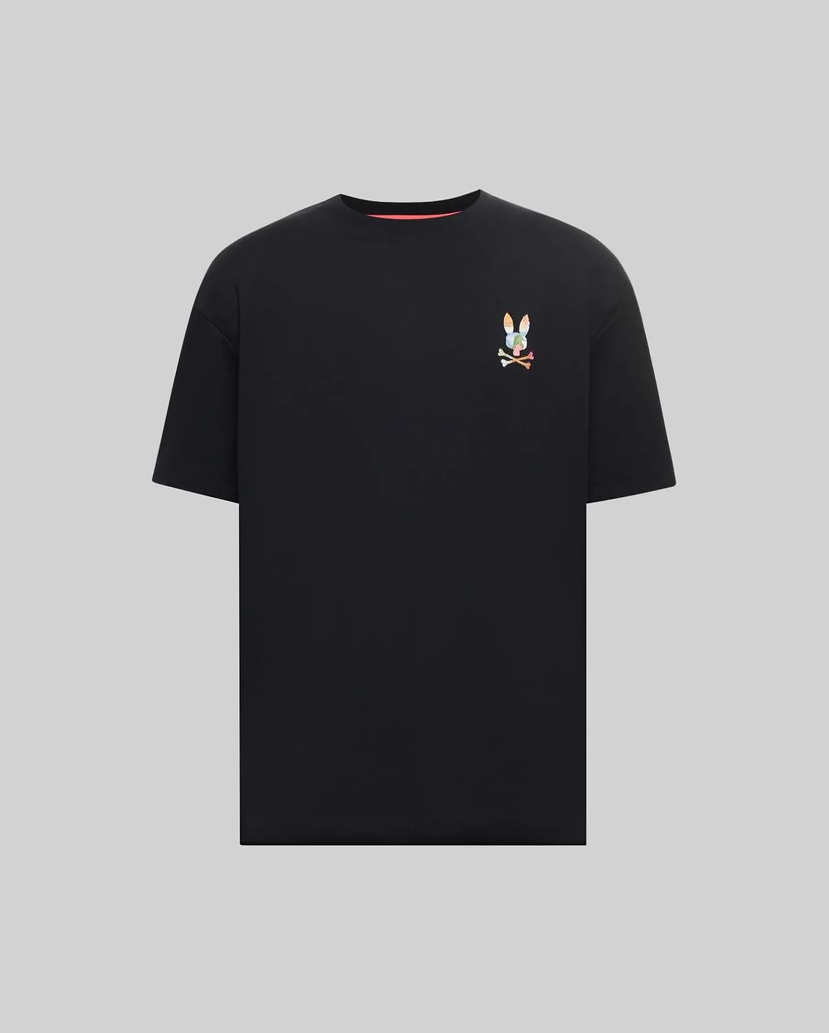 Mens Ara Oversized Tee, a black jersey knit t-shirt with a relaxed fit, featuring a small, vibrant multicolor embroidered Psycho Bunny skull logo on the left chest.