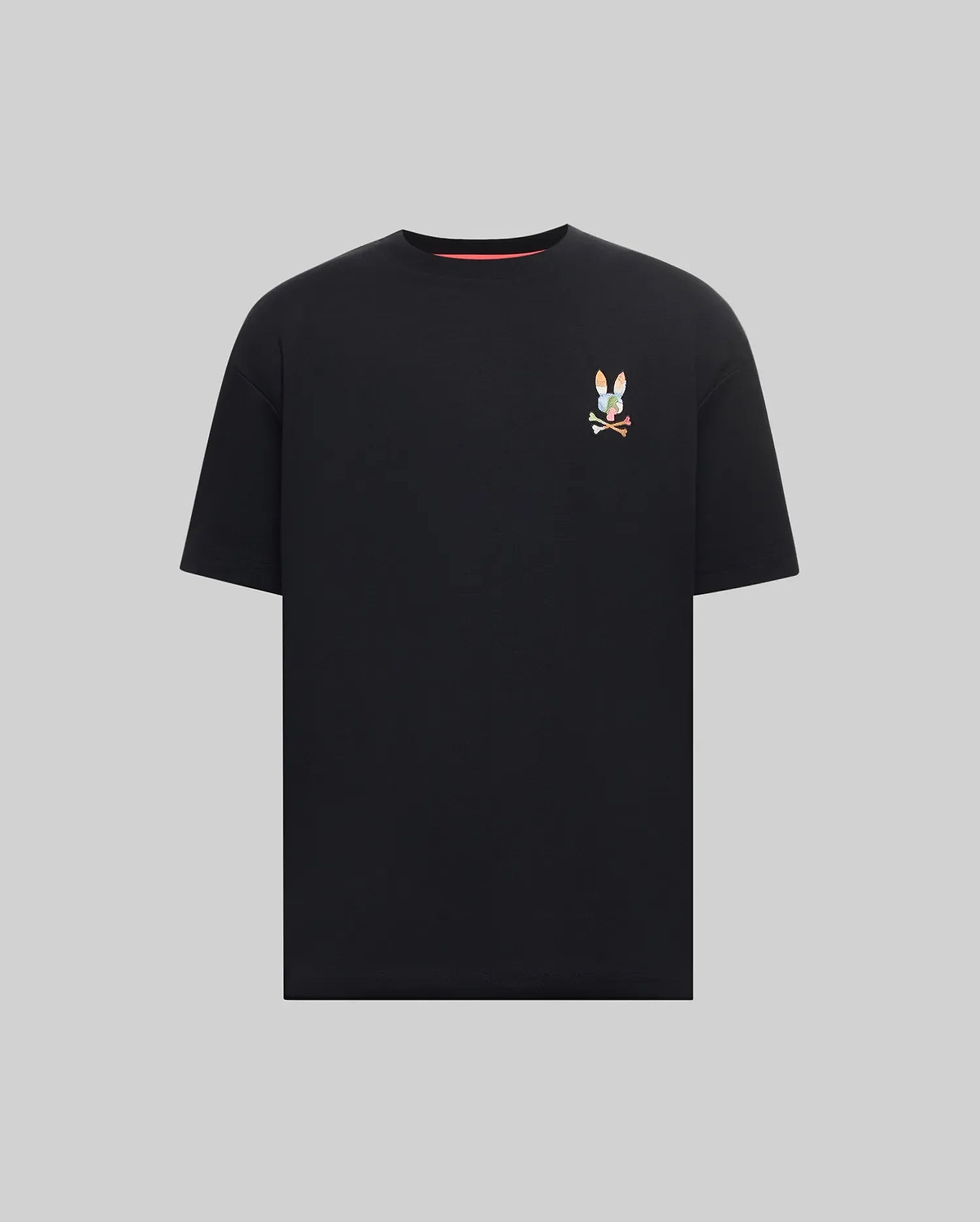 Mens Ara Oversized Tee, a black jersey knit t-shirt with a relaxed fit, featuring a small, vibrant multicolor embroidered Psycho Bunny skull logo on the left chest.