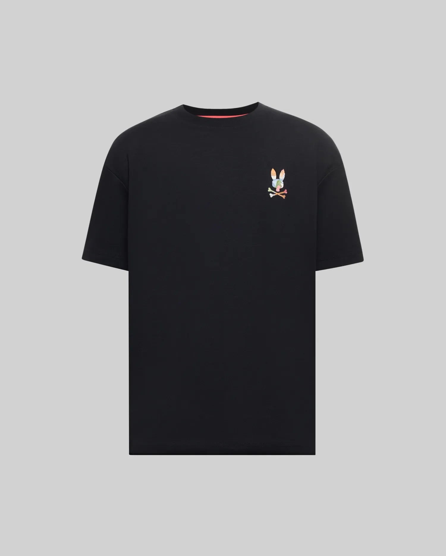 Mens Ara Oversized Tee, a black jersey knit t-shirt with a relaxed fit, featuring a small, vibrant multicolor embroidered Psycho Bunny skull logo on the left chest.
